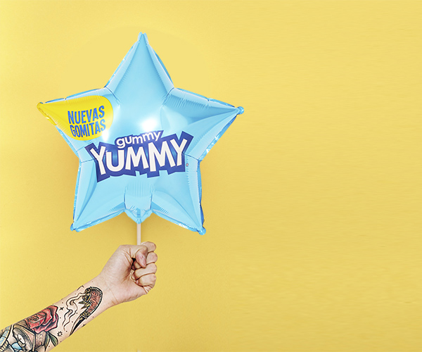 Custom star-shaped foil balloon featuring Yummy branding